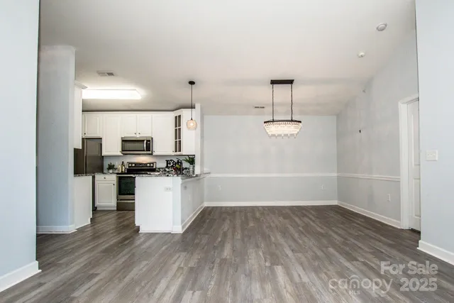 a view of a balcony with wooden floor