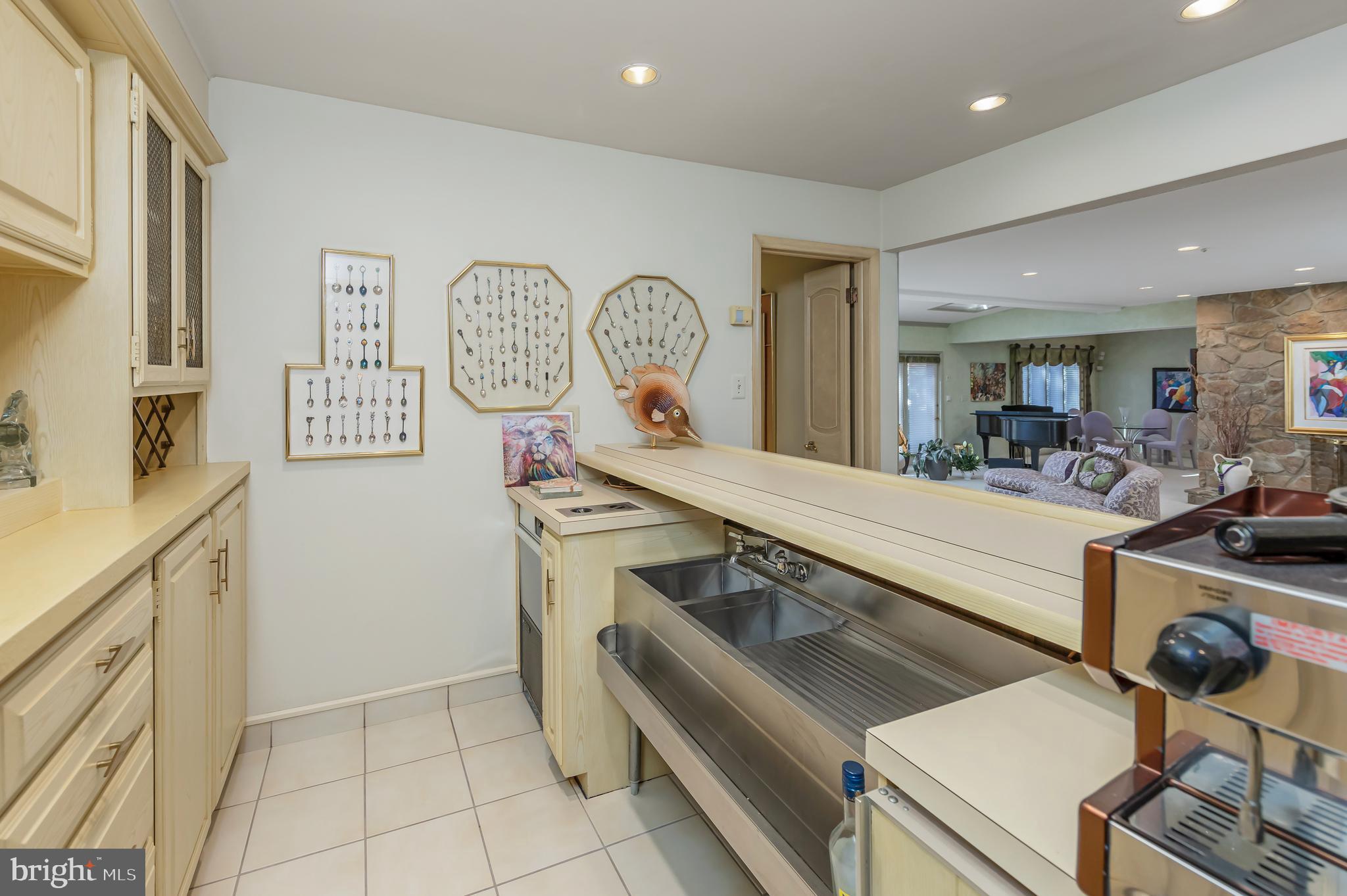 533 Heartwood Road Cherry Hill, NJ 08003 - Photo 15 of 55 a view of a kitchen with a stove a washer and dryer