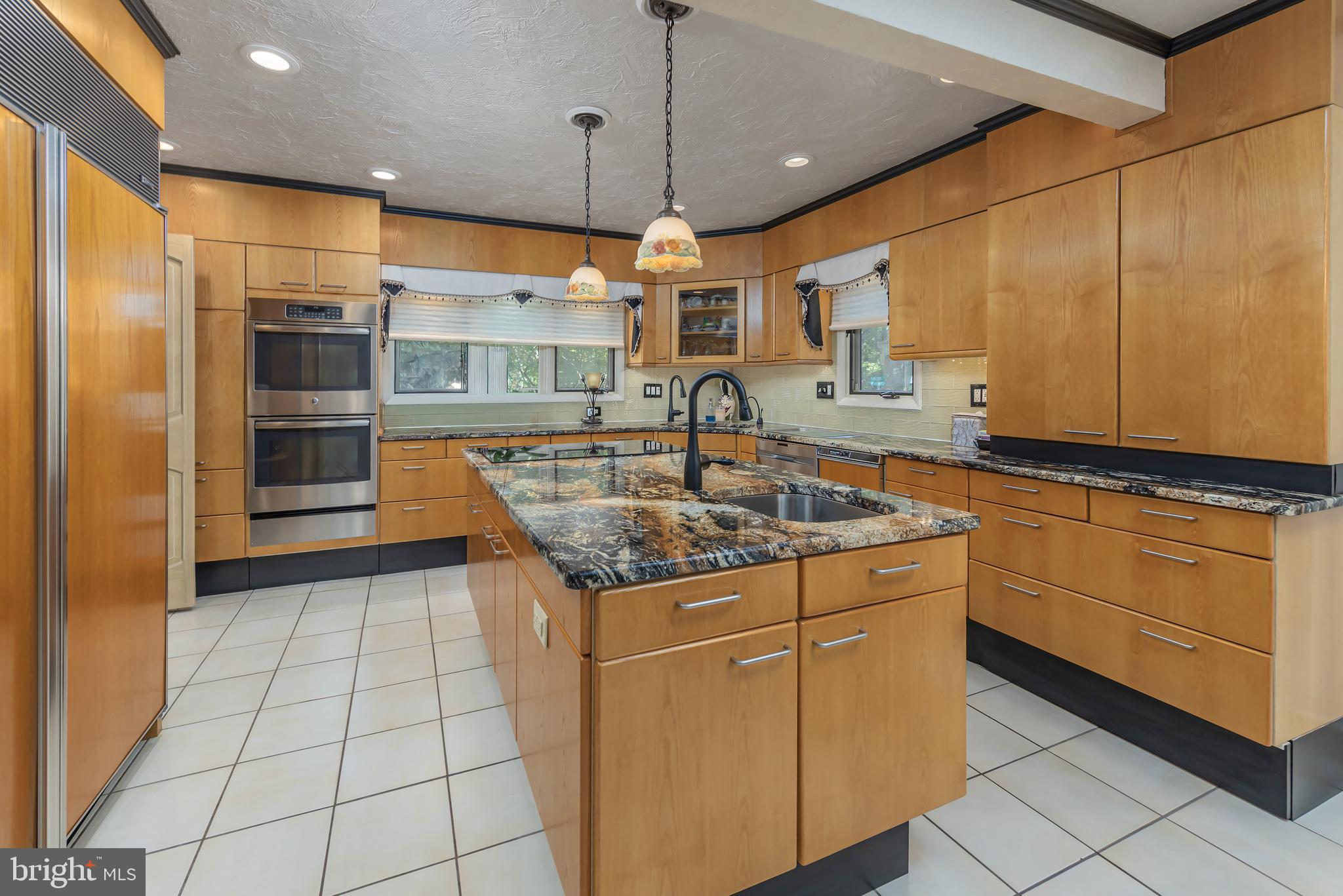 533 Heartwood Road Cherry Hill, NJ 08003 - Photo 16 of 55 a kitchen with stainless steel appliances granite countertop a sink and a refrigerator