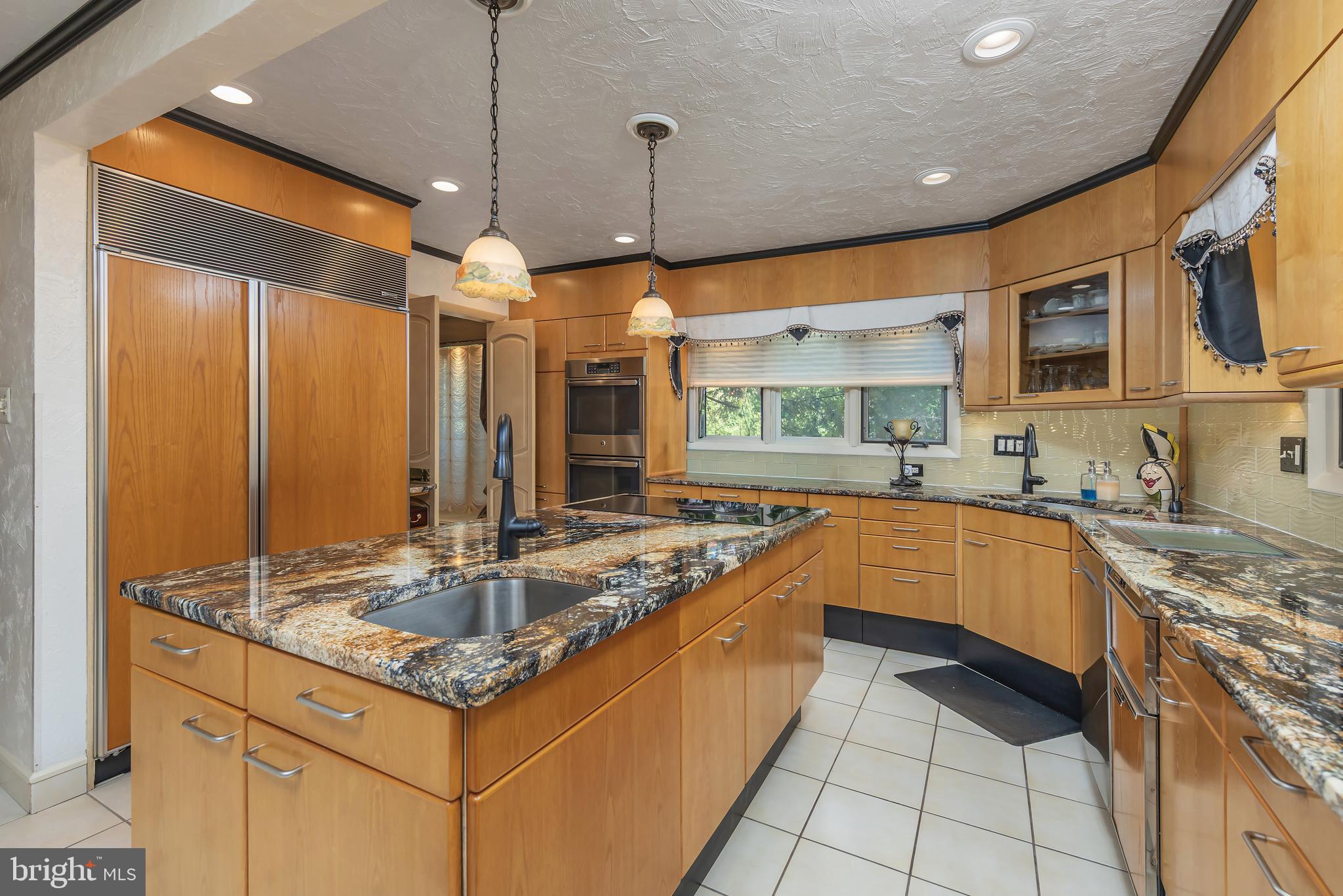 533 Heartwood Road Cherry Hill, NJ 08003 - Photo 17 of 55 a kitchen with stainless steel appliances granite countertop a sink and a stove