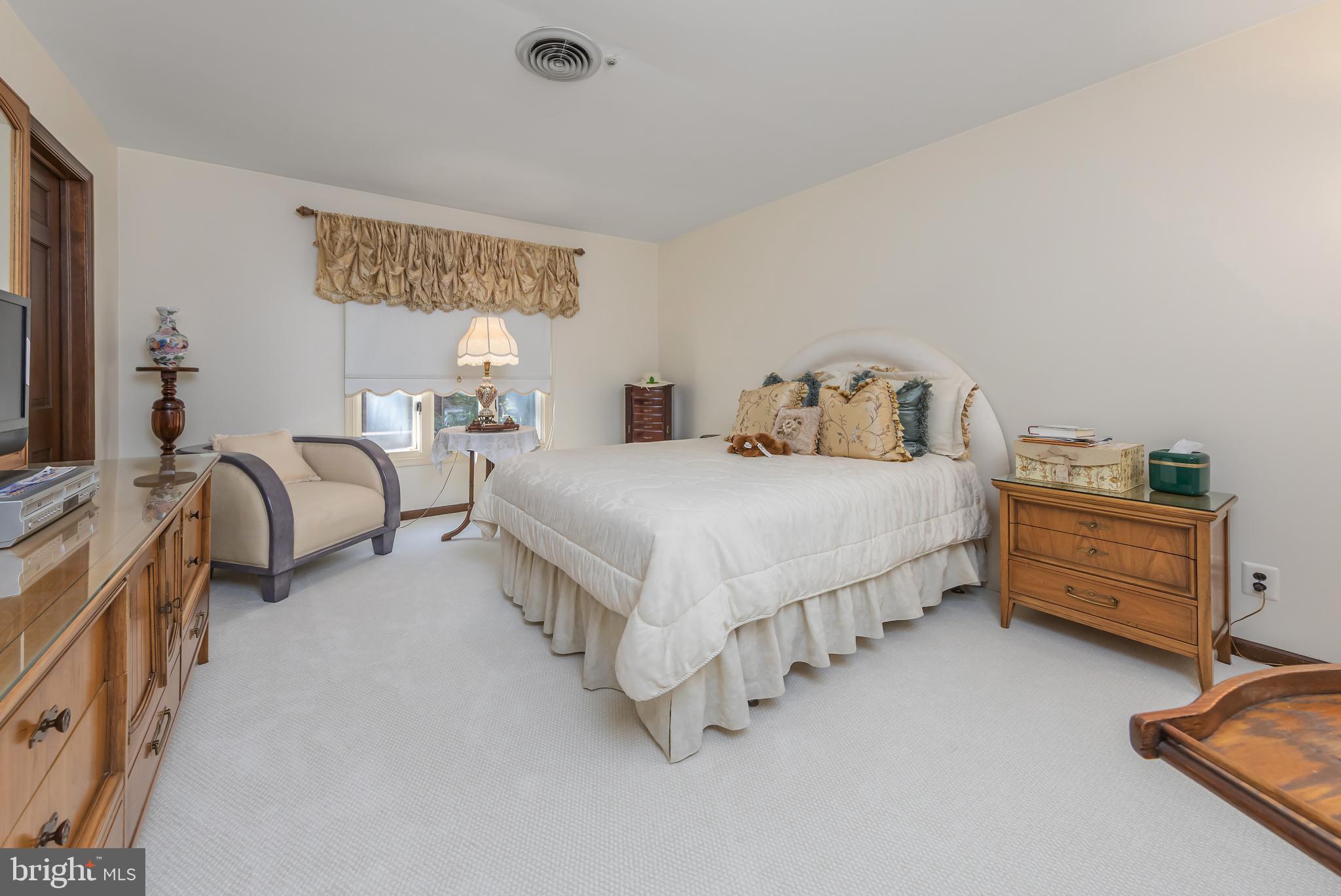 533 Heartwood Road Cherry Hill, NJ 08003 - Photo 34 of 55 a bedroom with a bed and a dresser