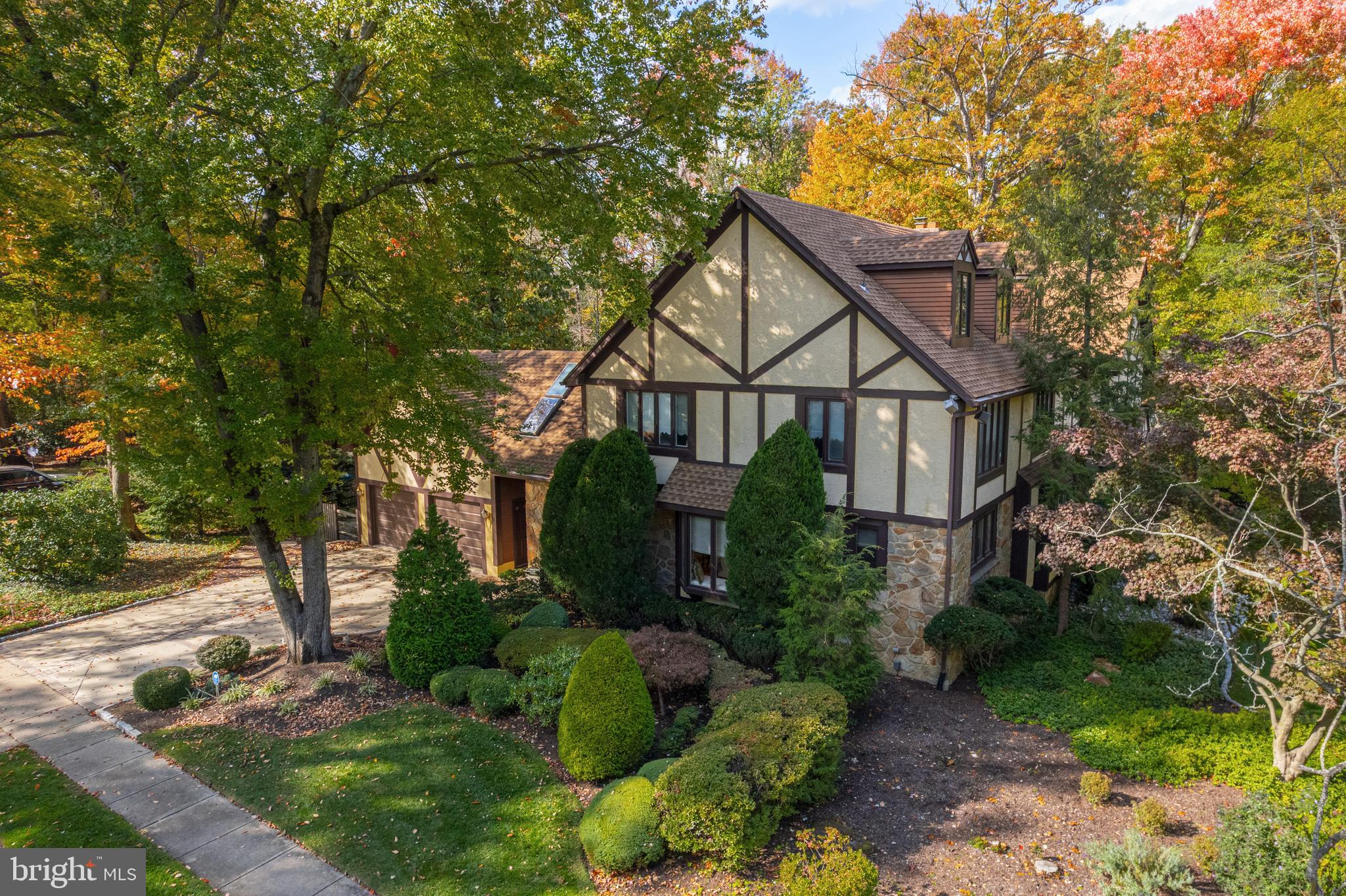 533 Heartwood Road Cherry Hill, NJ 08003 - Photo 52 of 55 a view of a white house next to a yard with plants and trees