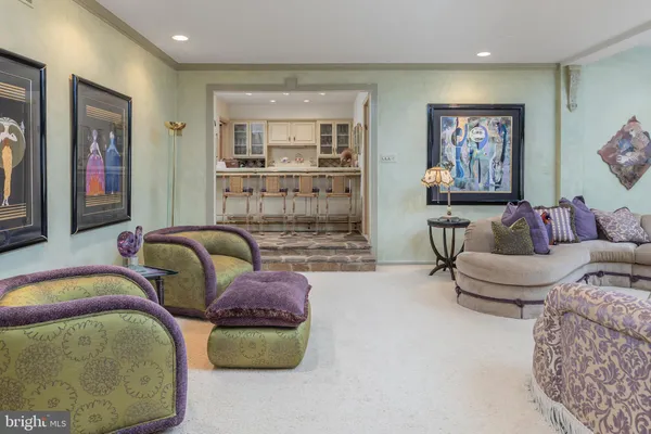 a spacious bedroom with a bed and a couch