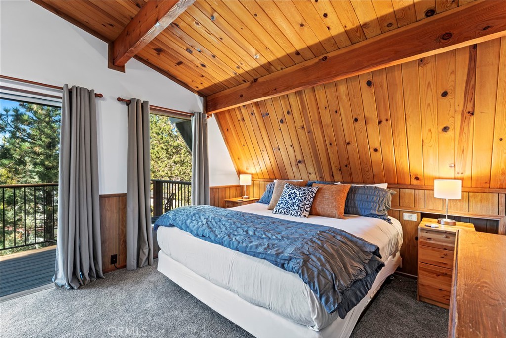 930 Bear Mountain Road Big Bear City, CA 92314 - Photo 19 of 39 a bedroom with a bed and a window