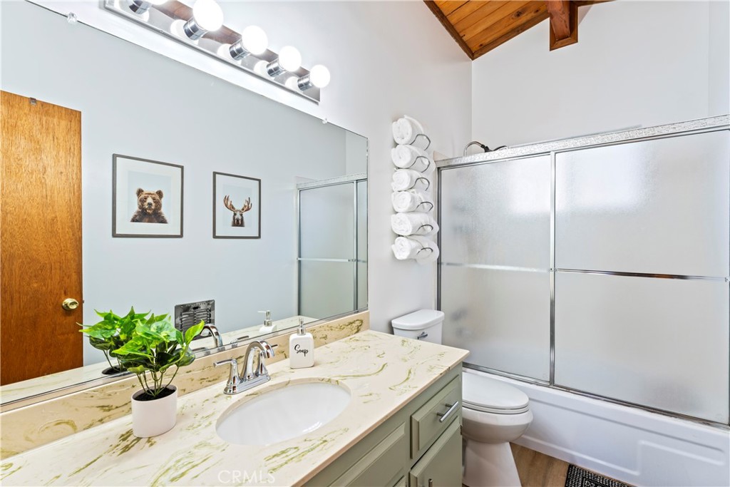 930 Bear Mountain Road Big Bear City, CA 92314 - Photo 24 of 39 a bathroom with a sink toilet and shower