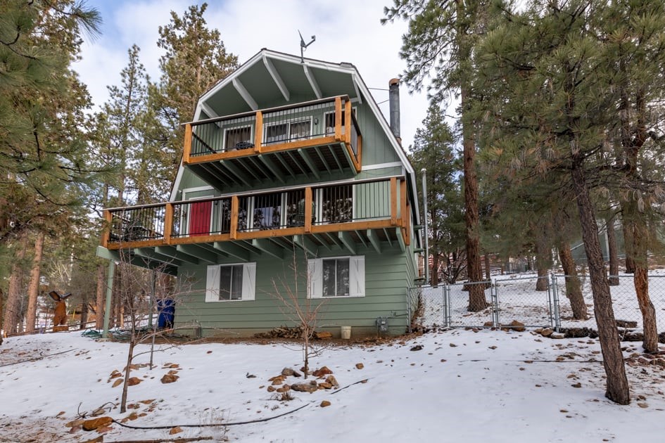 930 Bear Mountain Road Big Bear City, CA 92314 - Photo 3 of 39 a front view of a house with a yard