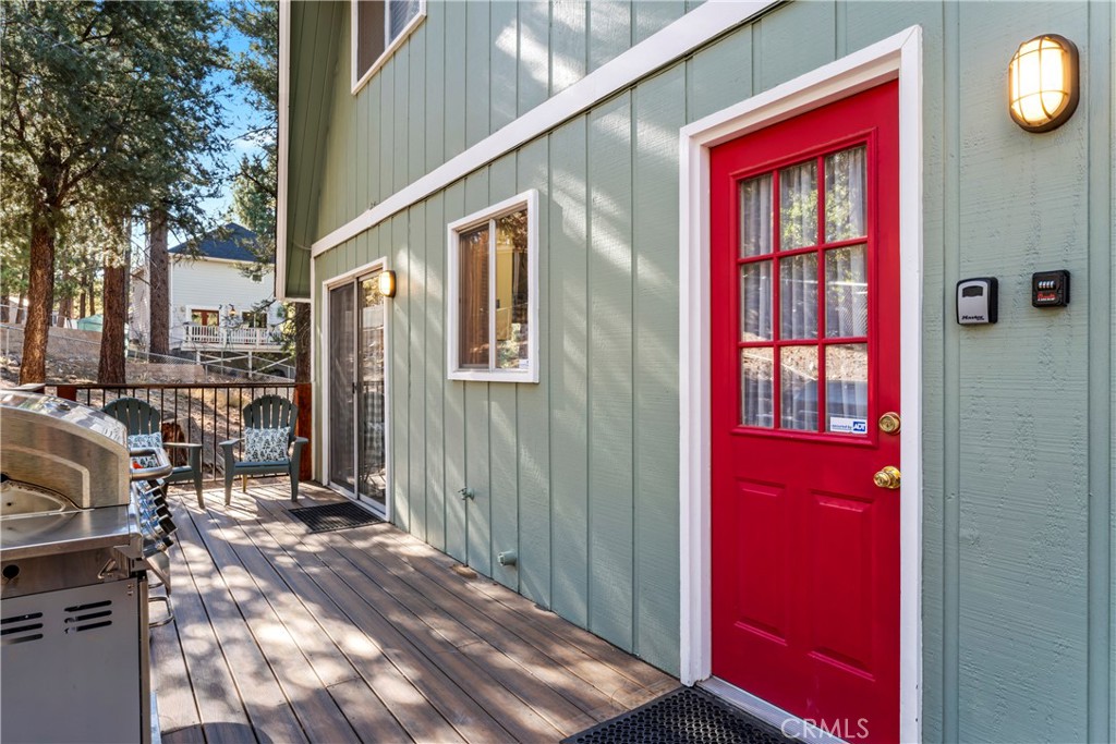 930 Bear Mountain Road Big Bear City, CA 92314 - Photo 30 of 39 a front view of a house with a yard