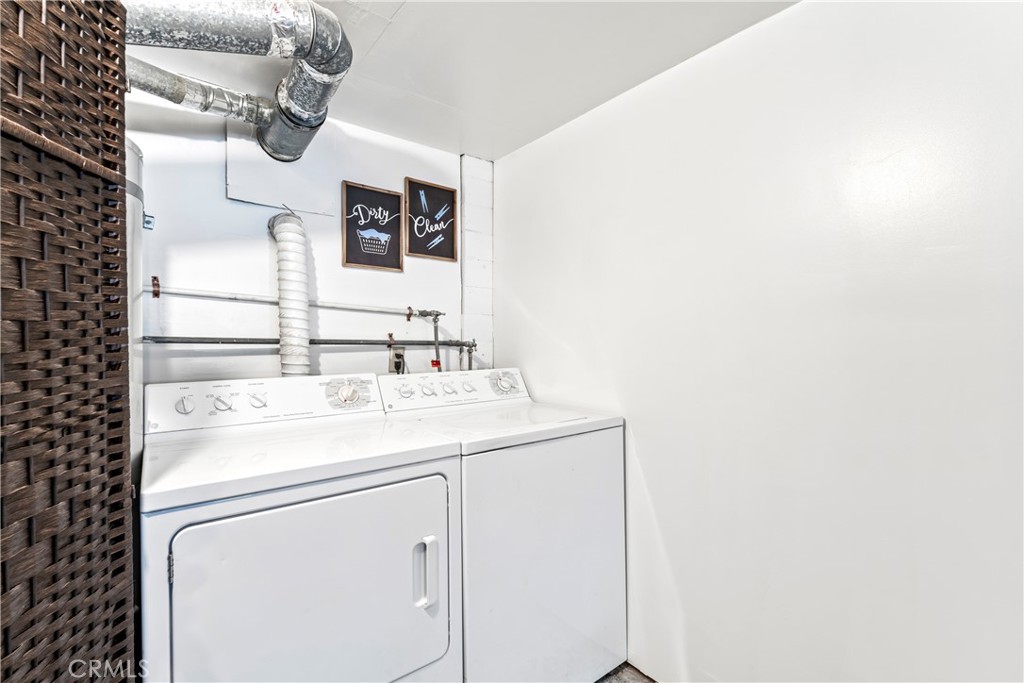 930 Bear Mountain Road Big Bear City, CA 92314 - Photo 33 of 39 a utility room with dryer and washer