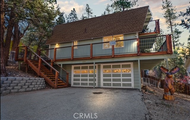 930 Bear Mountain Road Big Bear City, CA 92314 - Photo 34 of 39 a view of a house with a balcony