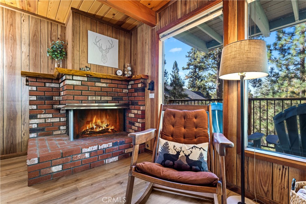 930 Bear Mountain Road Big Bear City, CA 92314 - Photo 4 of 39 a living room with furniture and a fireplace