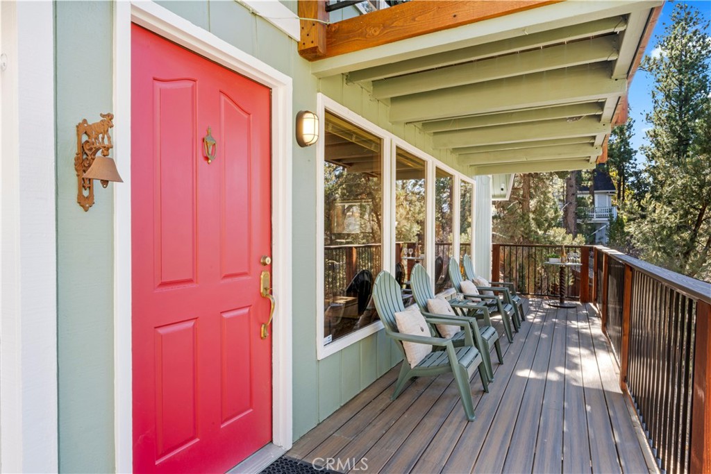 930 Bear Mountain Road Big Bear City, CA 92314 - Photo 8 of 39 a balcony with table and chairs
