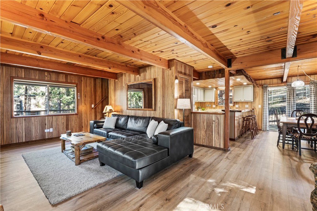930 Bear Mountain Road Big Bear City, CA 92314 - Photo 9 of 39 a living room with lots of furniture and kitchen view