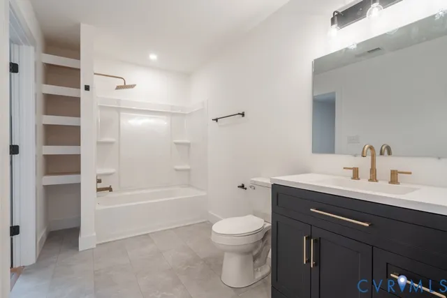 a bathroom with a sink a toilet and a bathtub