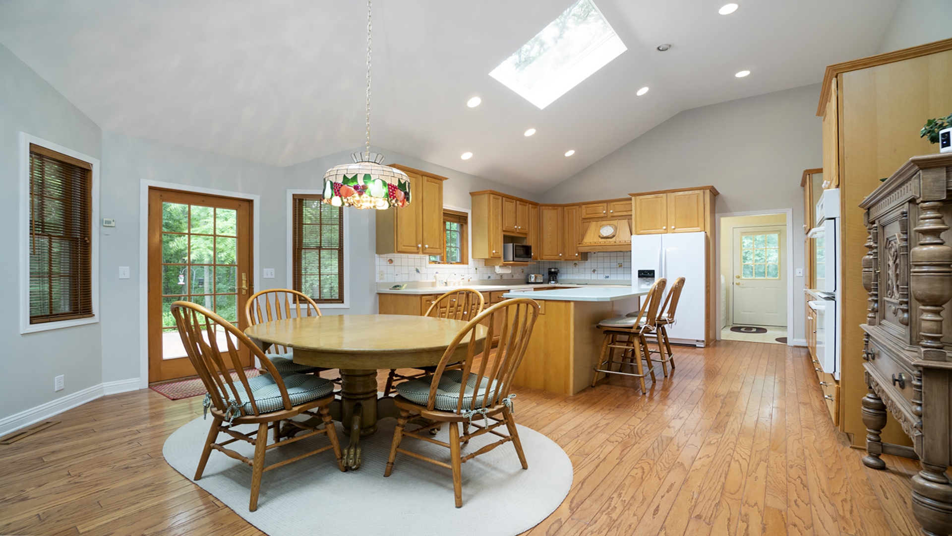 7176 South Lost Nation Road Dixon, IL 61021 - Photo 8 of 52 a view of a dining room with furniture and wooden floor