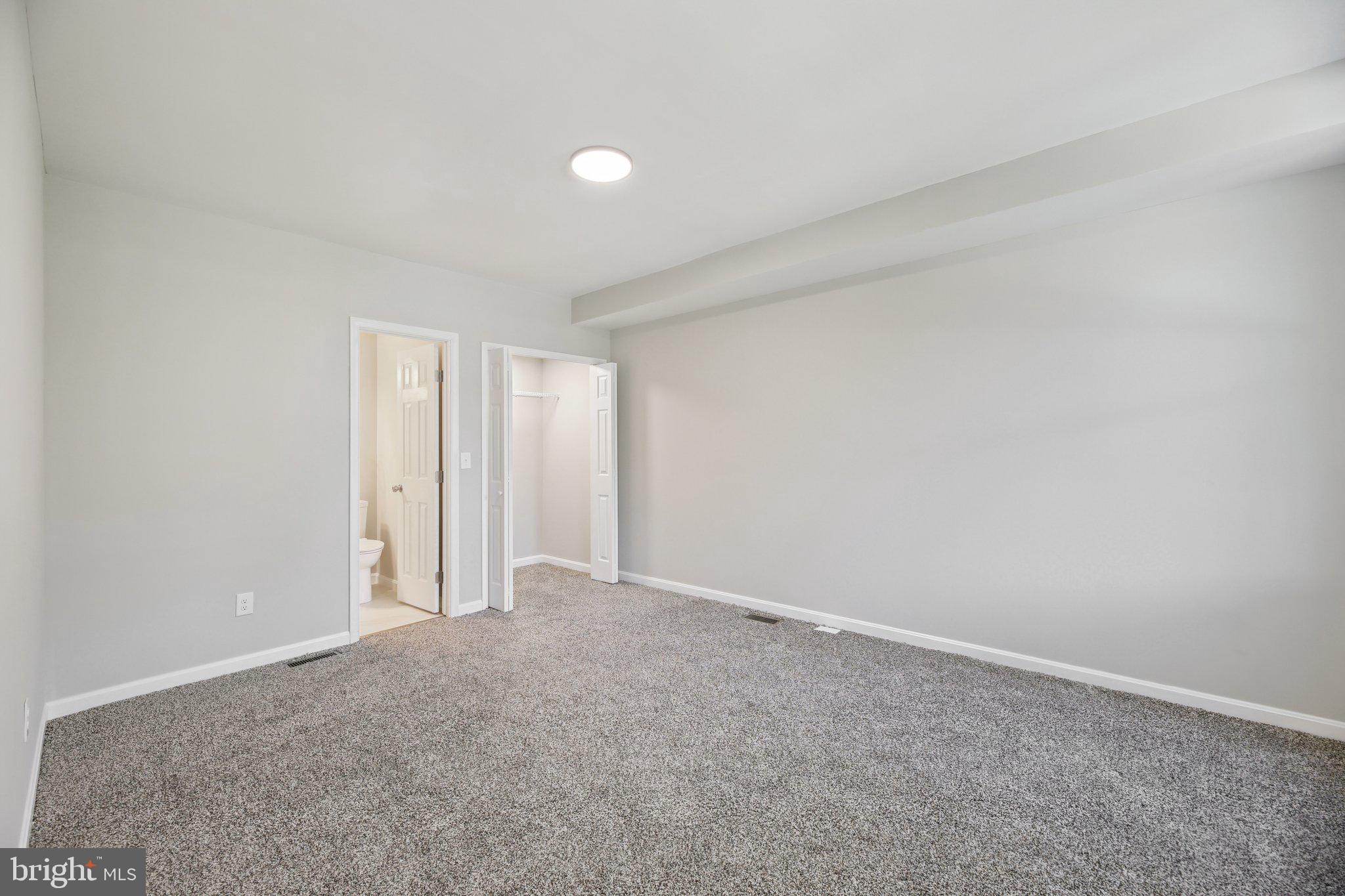 329 East University Parkway Baltimore, MD 21218 - Photo 11 of 38 a view of an empty room and window