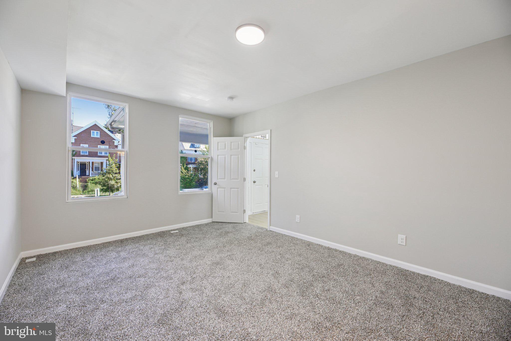 329 East University Parkway Baltimore, MD 21218 - Photo 12 of 38 an empty room with windows