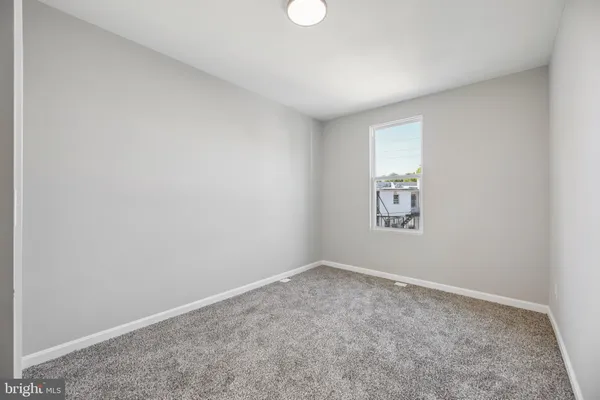 an empty room with closet area