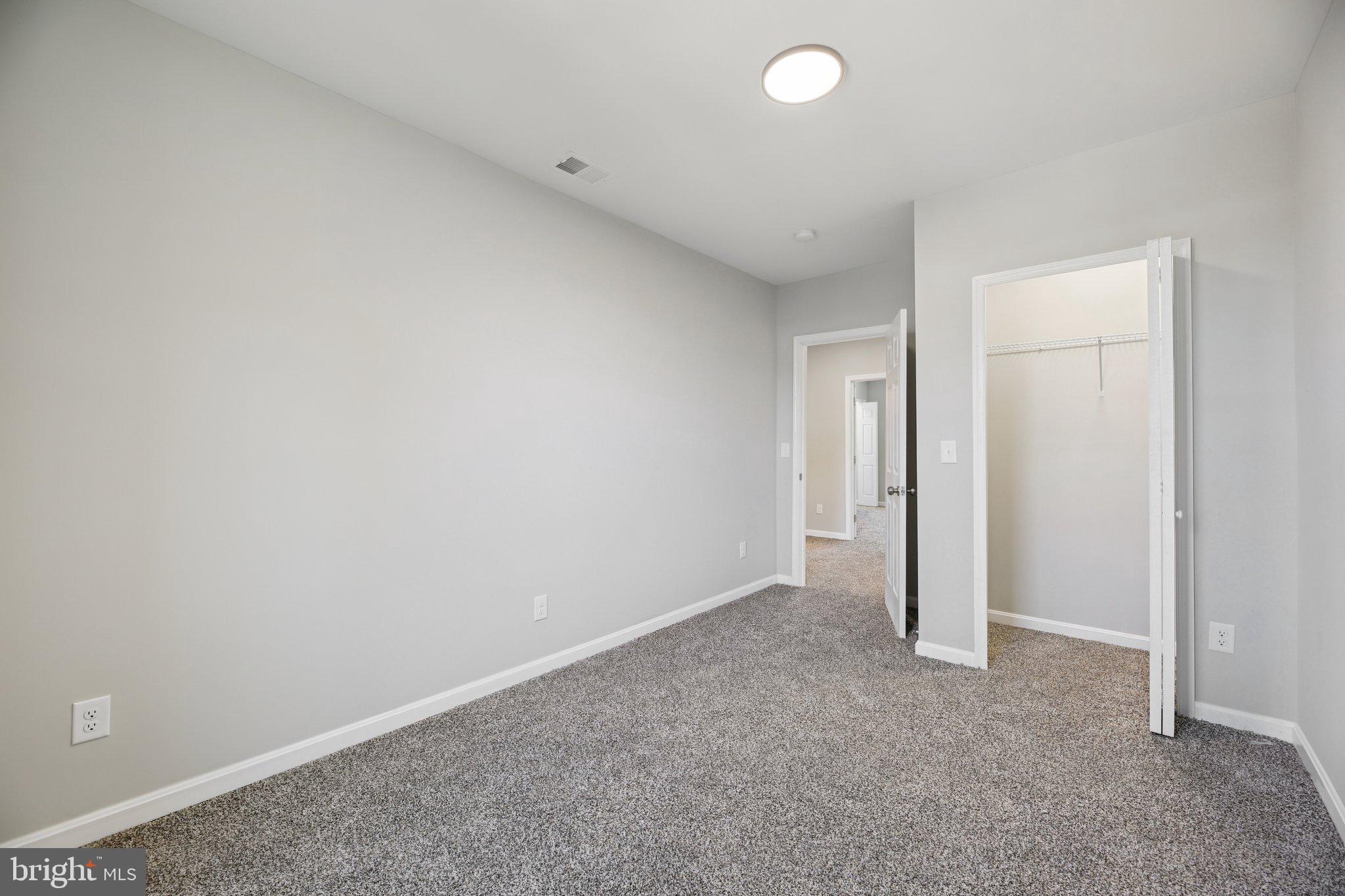 329 East University Parkway Baltimore, MD 21218 - Photo 15 of 38 an empty room with closet area