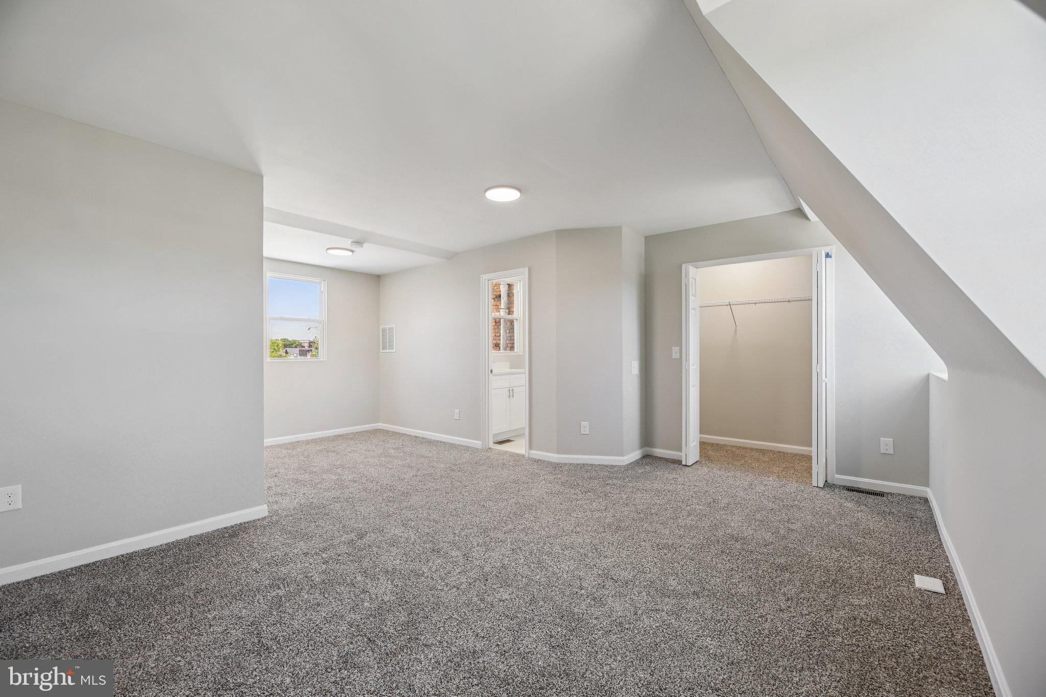 329 East University Parkway Baltimore, MD 21218 - Photo 23 of 38 an empty room with an entryway