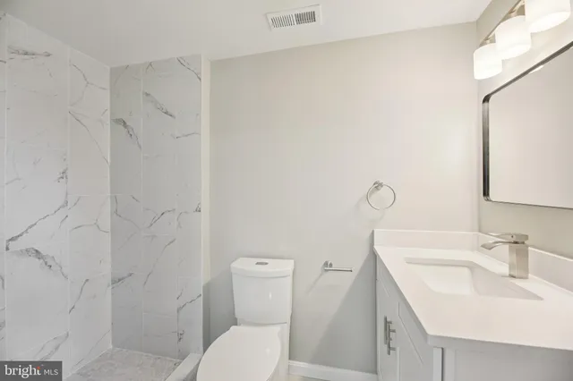 a picture of a park with a bench