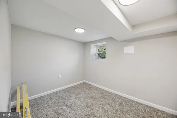 an empty room with a empty space and a window