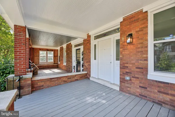 a view of a livingroom with wooden floor and entryway