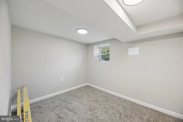 an empty room with a empty space and a window