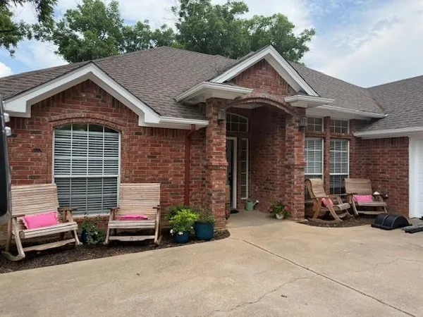 a view of a car park in front of house