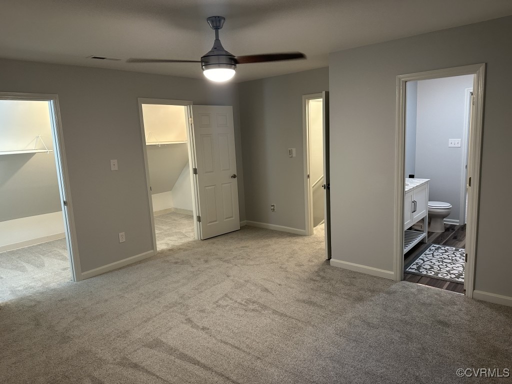 3023 Gregwood Road Midlothian, VA 23112 - Photo 12 of 17 a view of a livingroom with a chandelier fan and a bathroom