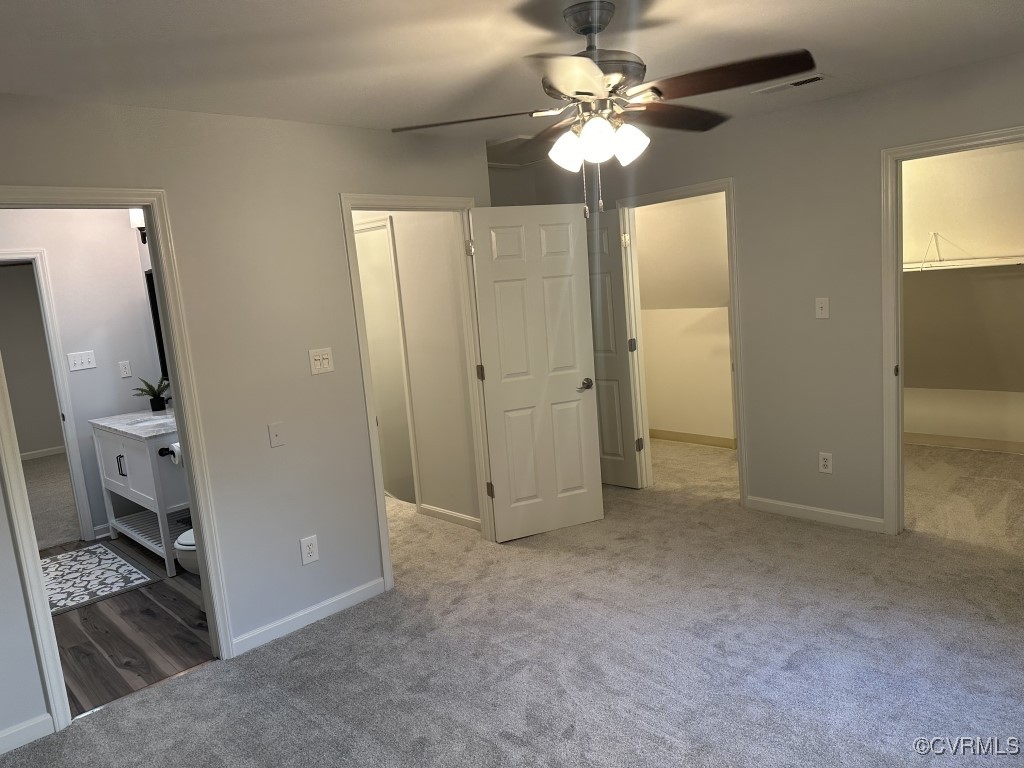 3023 Gregwood Road Midlothian, VA 23112 - Photo 9 of 17 wooden floor in an empty room with a bathroom
