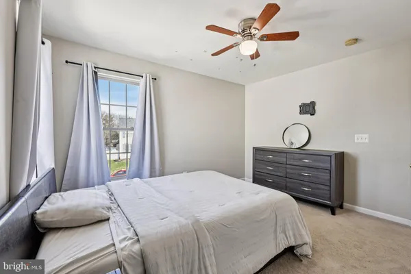 a bed room with a bed and a book shelf