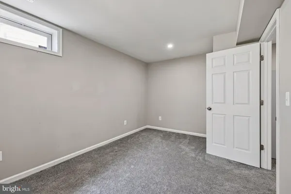 a storage room with lots of clutter and bicycles