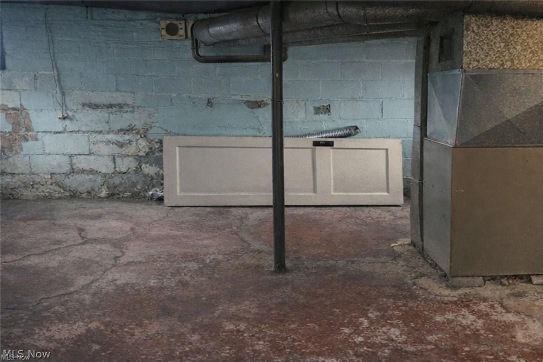 1911 Youngstown Road Southeast Warren, OH 44484 - Photo 12 of 17 Unfinished below grade area featuring heating unit