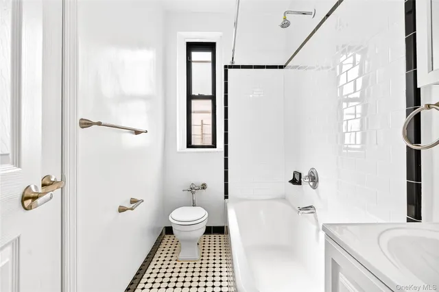 a bathroom with a sink toilet a shower and a bathtub