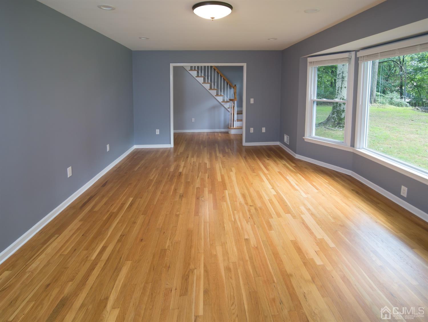 6 Coventry Square Holmdel, NJ 07733 - Photo 11 of 36 a view of empty room with wooden floor and fan