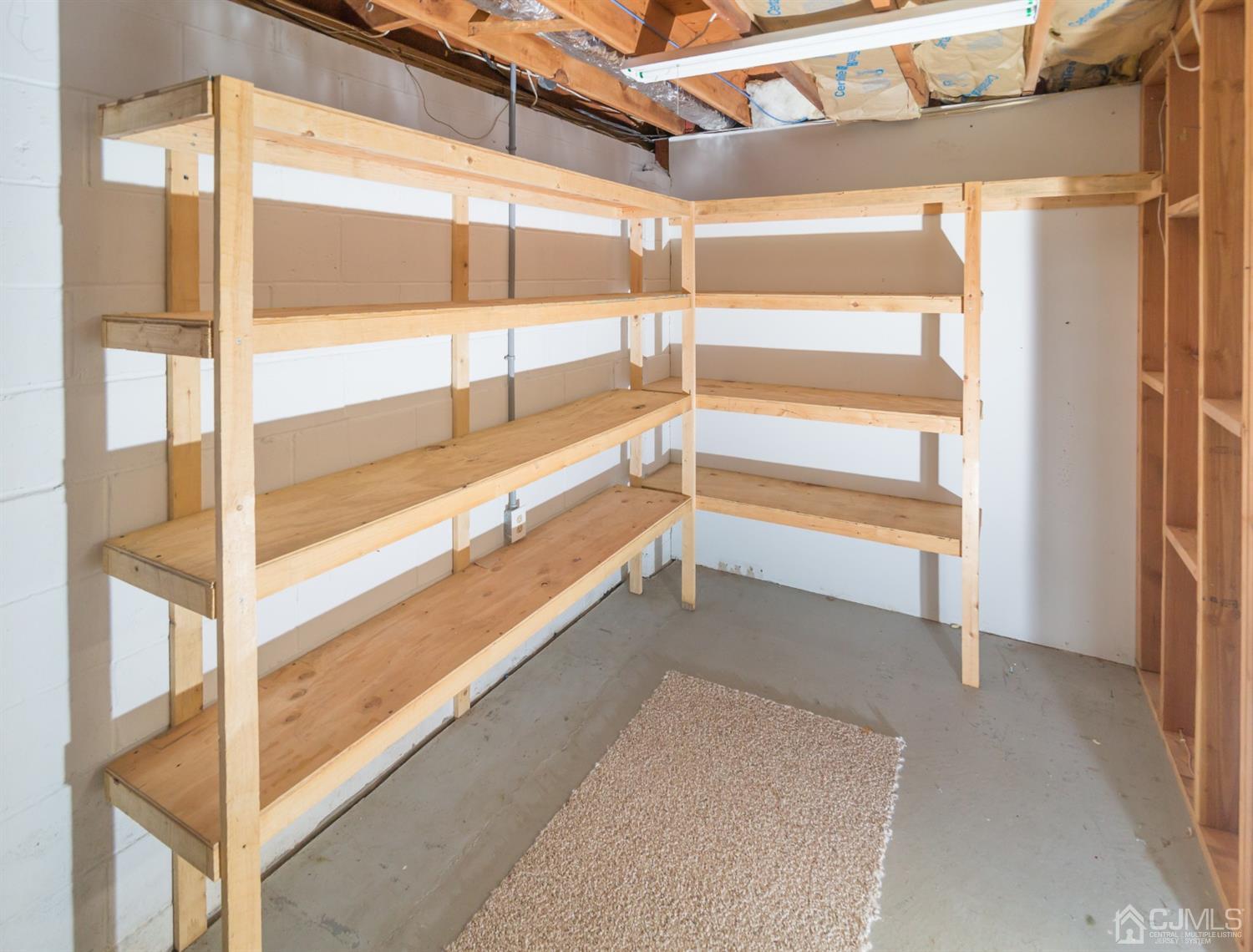 6 Coventry Square Holmdel, NJ 07733 - Photo 26 of 36 a view of an empty room with wooden floor and windows