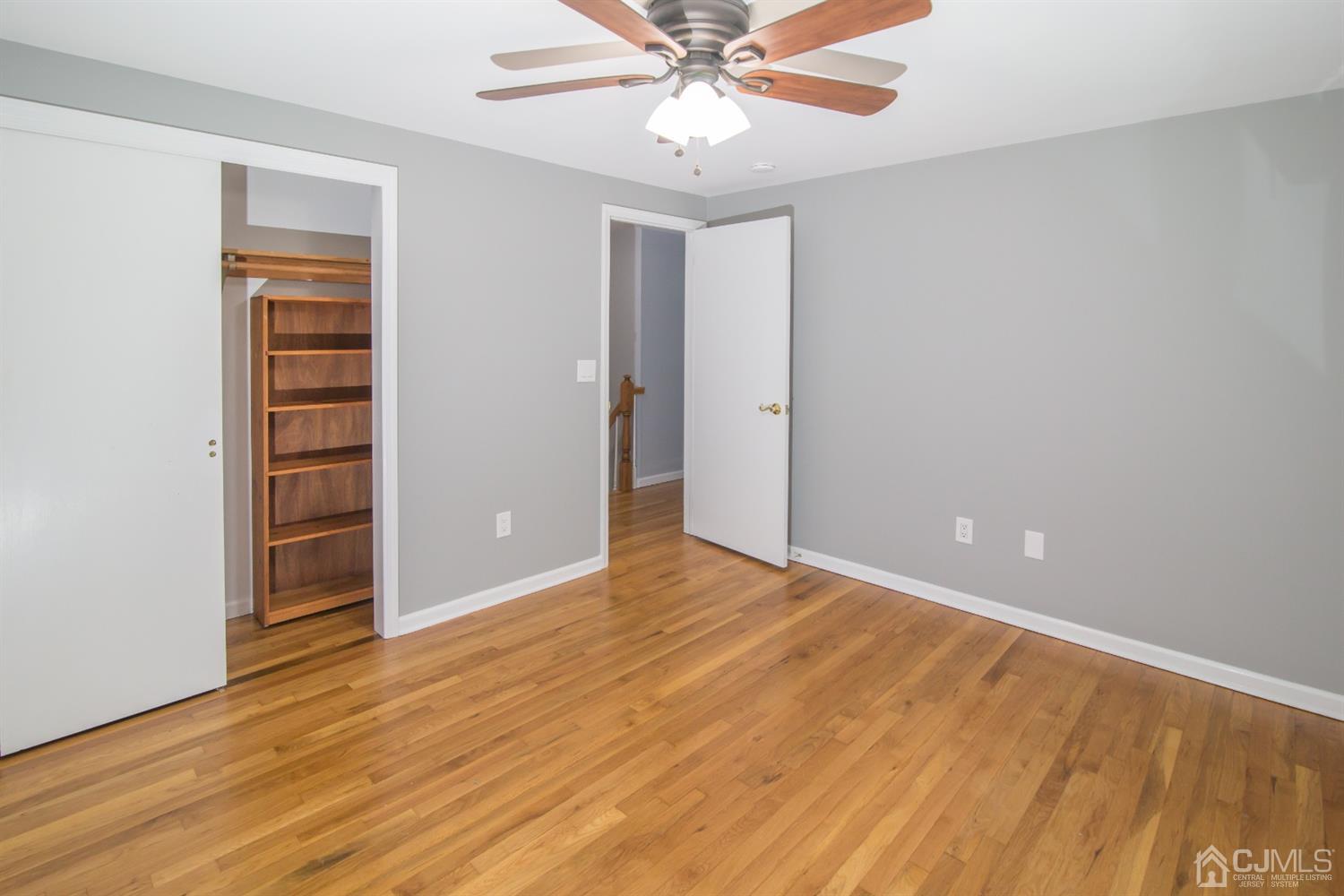 6 Coventry Square Holmdel, NJ 07733 - Photo 29 of 36 wooden floor in an empty room with a window