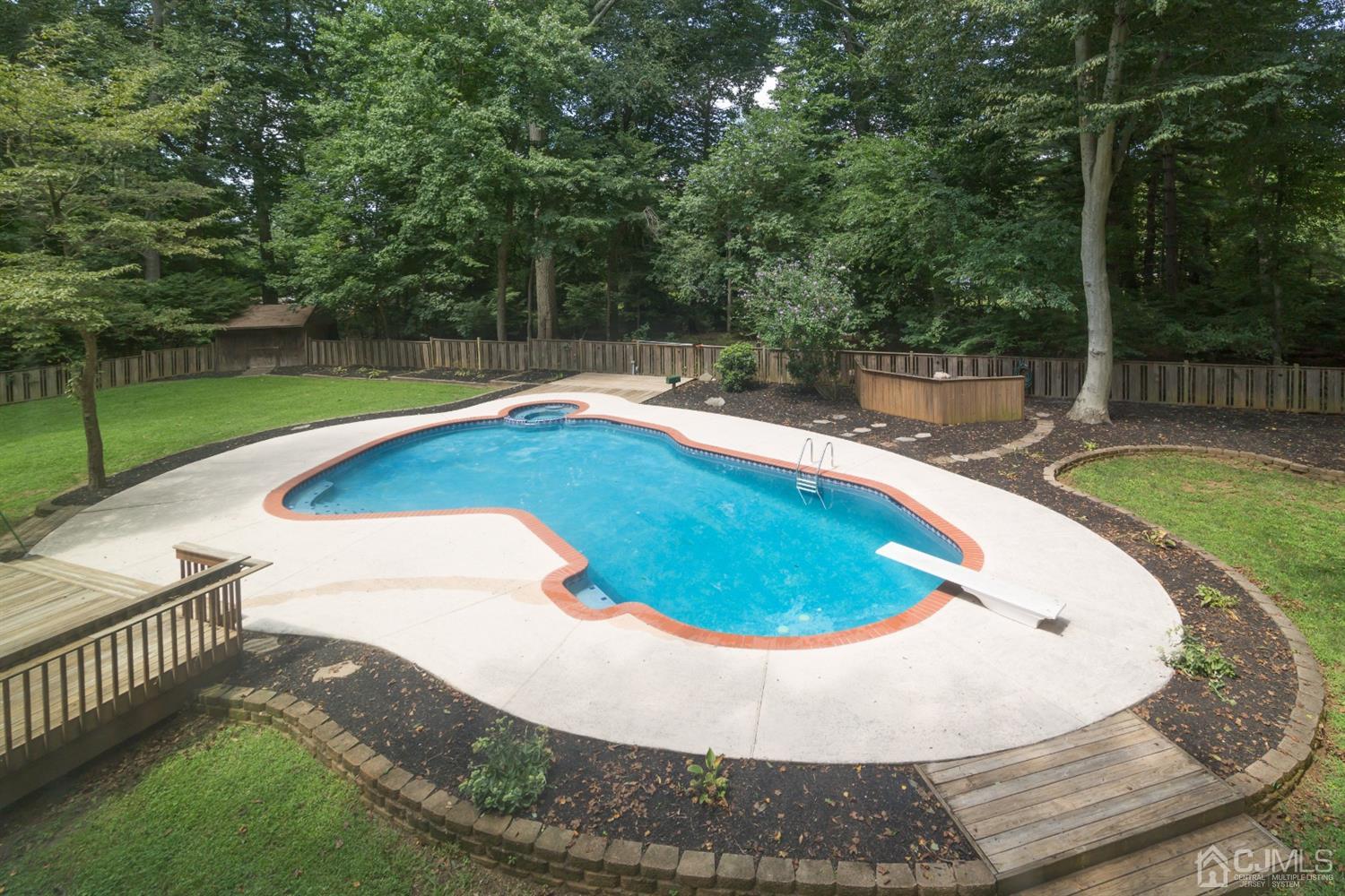 6 Coventry Square Holmdel, NJ 07733 - Photo 31 of 36 a view of a swimming pool with a patio