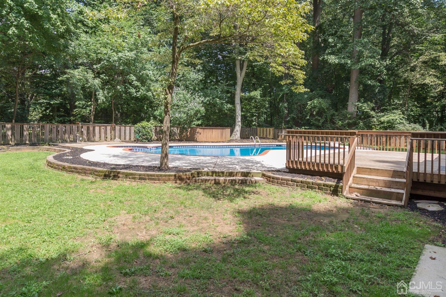 6 Coventry Square Holmdel, NJ 07733 - Photo 32 of 36 a view of a park with slide