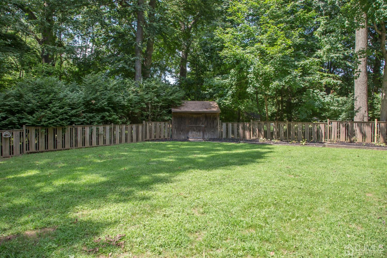 6 Coventry Square Holmdel, NJ 07733 - Photo 33 of 36 a view of a back yard with green space