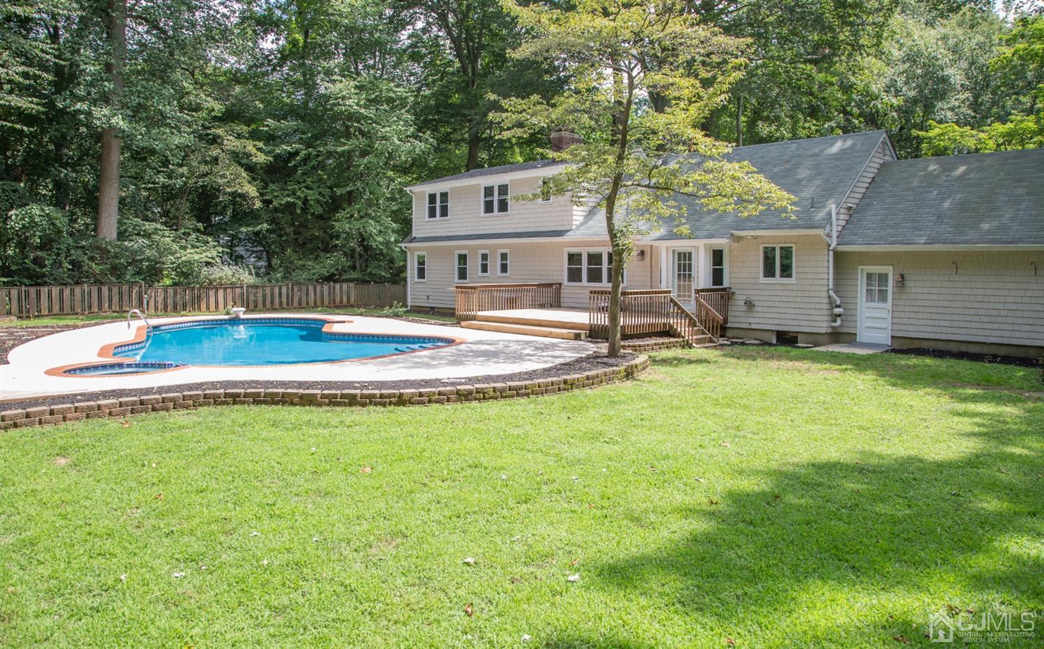 6 Coventry Square Holmdel, NJ 07733 - Photo 35 of 36 a front view of a house with garden