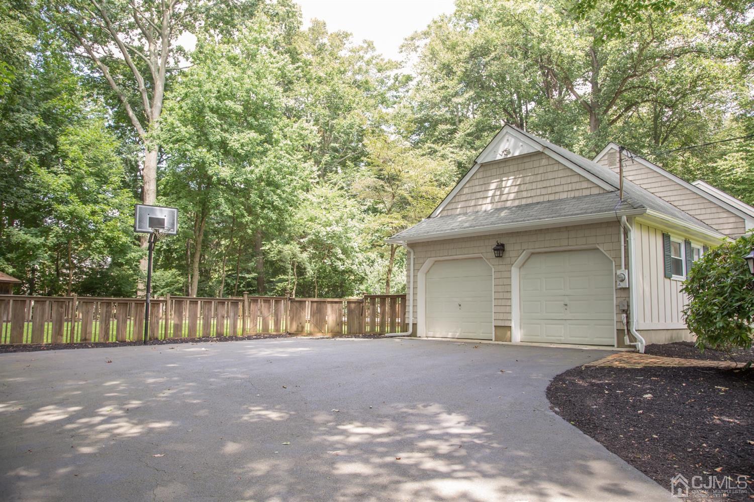 6 Coventry Square Holmdel, NJ 07733 - Photo 36 of 36 a front view of a house with a garden and trees