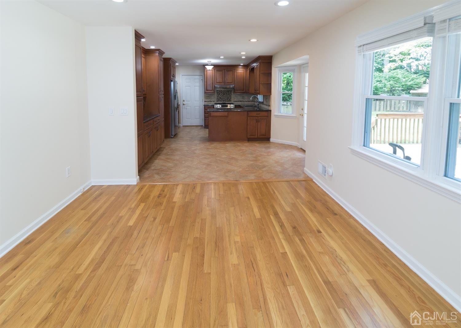 6 Coventry Square Holmdel, NJ 07733 - Photo 9 of 36 a view of a room with wooden floor and windows