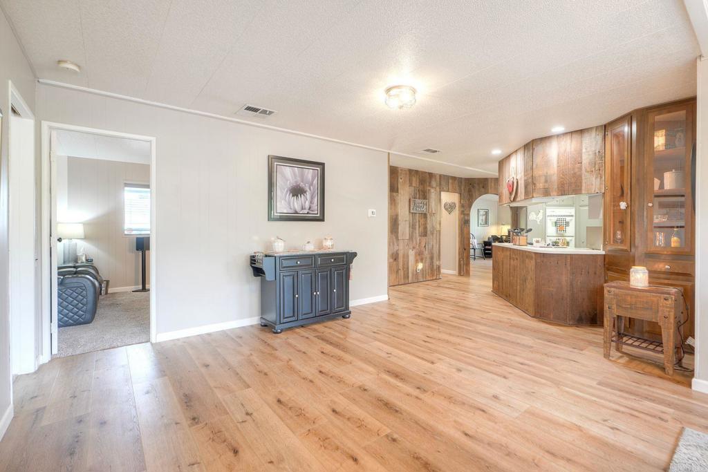 18218 Paradise Mountain Road Valley Center, CA 92082 - Photo 13 of 42 a room with a bed and a view of kitchen