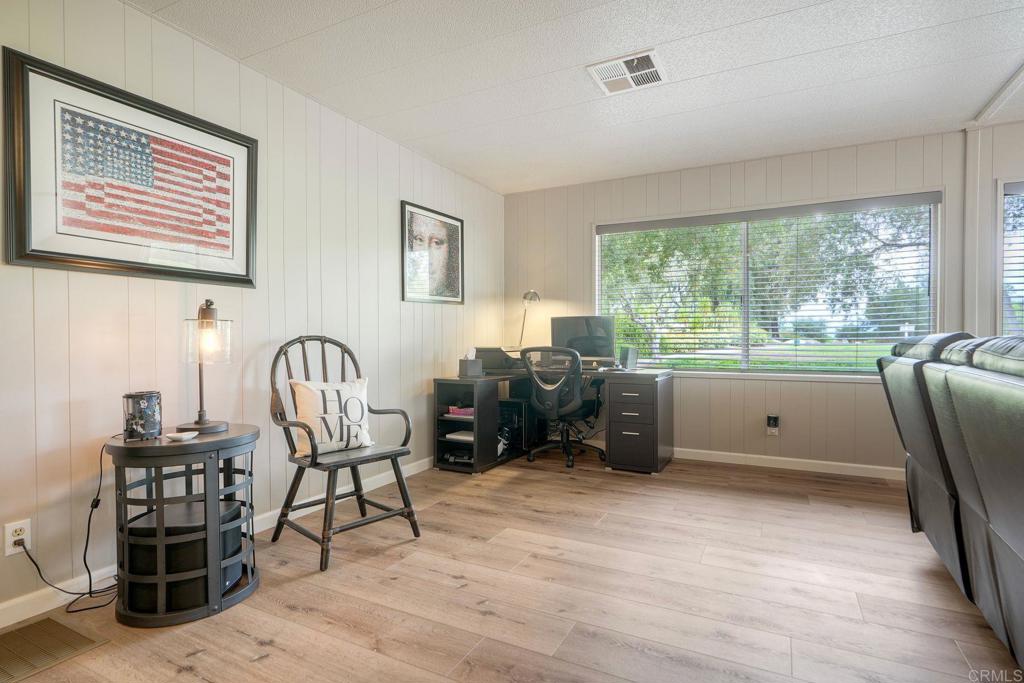 18218 Paradise Mountain Road Valley Center, CA 92082 - Photo 19 of 42 a living room with furniture and a large window