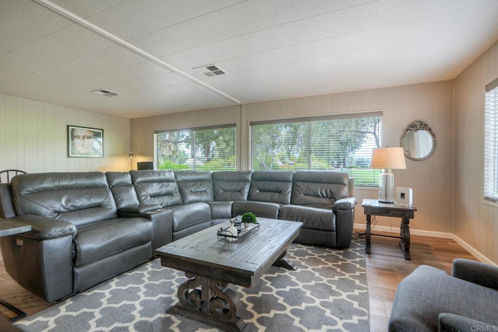 18218 Paradise Mountain Road Valley Center, CA 92082 - Photo 21 of 42 a living room with furniture and a large window