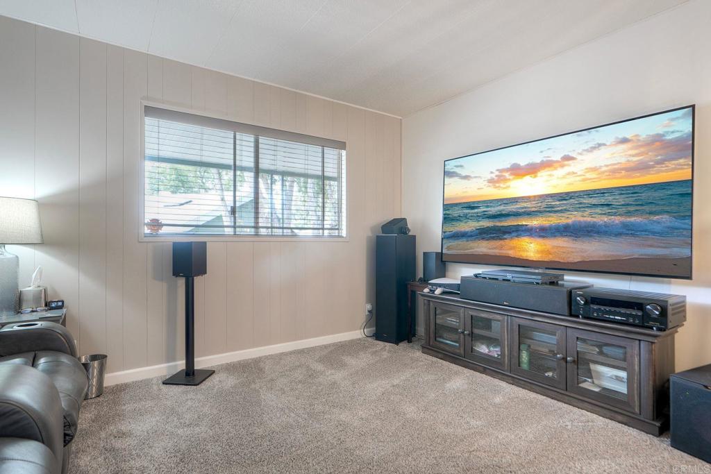 18218 Paradise Mountain Road Valley Center, CA 92082 - Photo 24 of 42 a view of kitchen with furniture flat screen tv and window