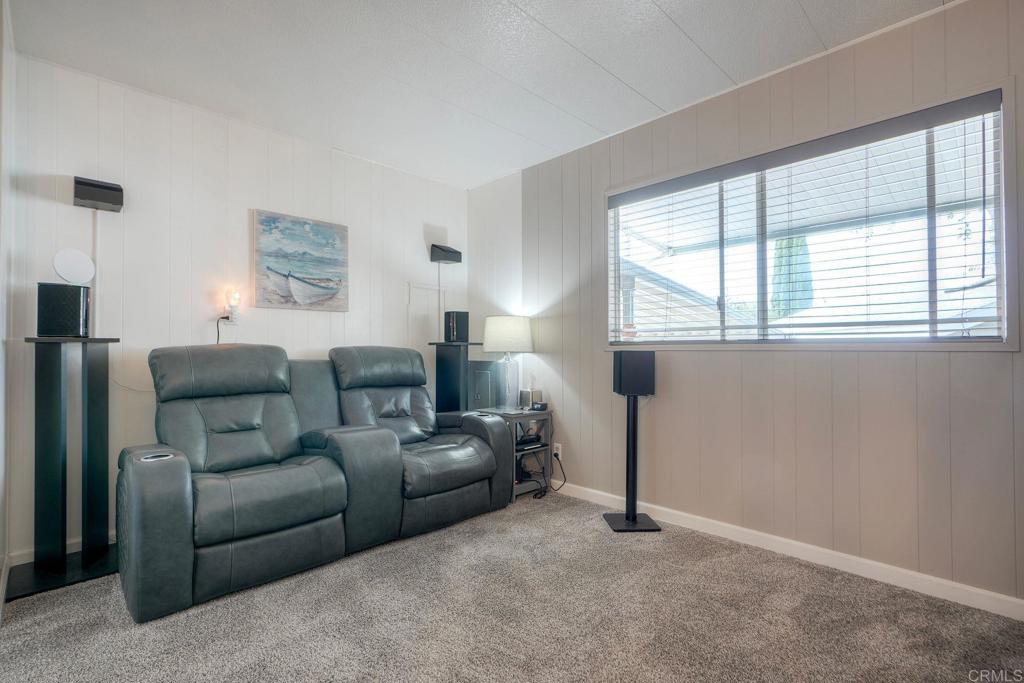 18218 Paradise Mountain Road Valley Center, CA 92082 - Photo 25 of 42 a living room with furniture and a window