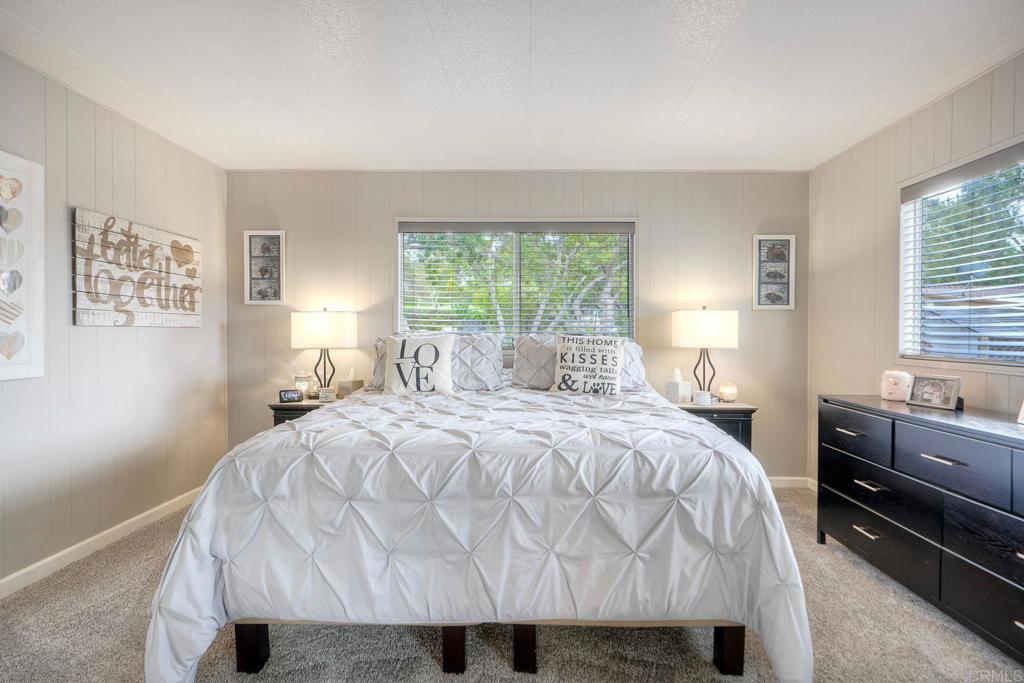 18218 Paradise Mountain Road Valley Center, CA 92082 - Photo 27 of 42 a bedroom with a bed and window