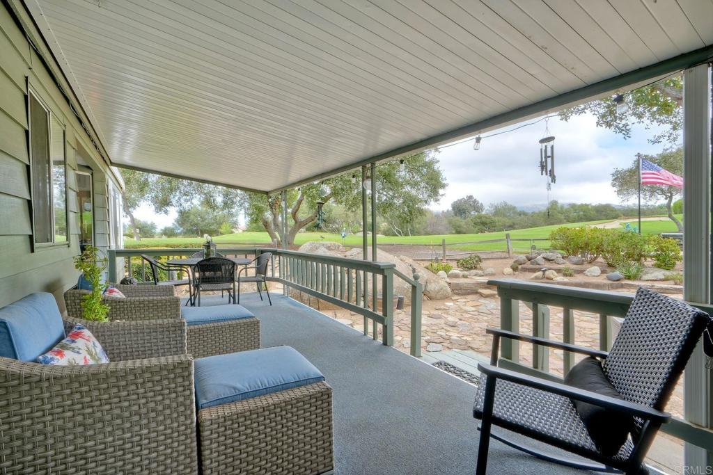 18218 Paradise Mountain Road Valley Center, CA 92082 - Photo 3 of 42 a view of a porch with furniture and garden